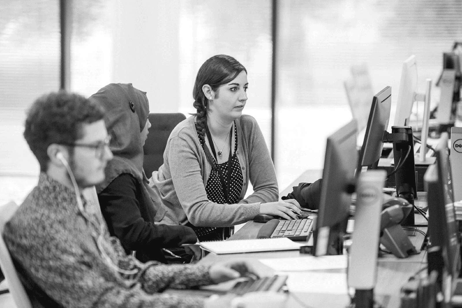Resourcly operations team working at a row of monitors